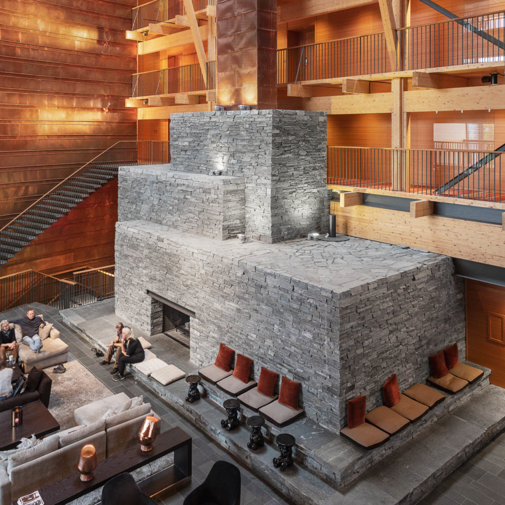 A large fireplace in bricks of gray Offerdal slate mounted as a dry wall at Copperhill Mountain Lodge.