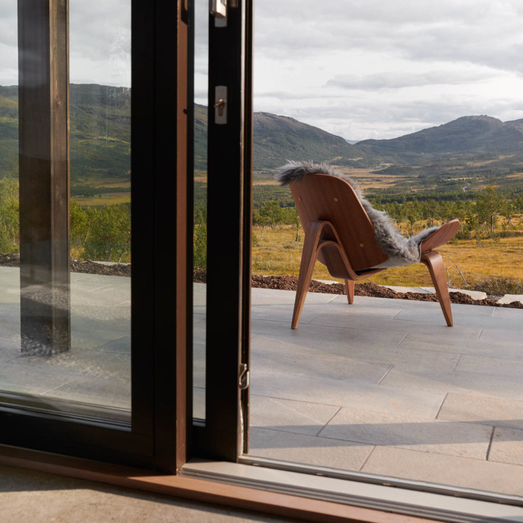 Outdoor tiles in Oppdal slate on a terrace for a tight and modern look in a cottage.